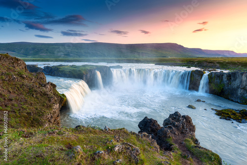 Sunset over Godafoss waterfall flowing in summer at Iceland