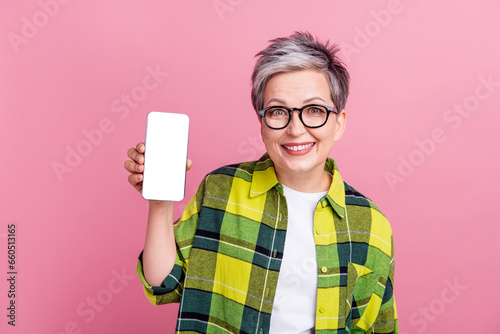 Vászonkép Portrait of toothy beaming person dressed plaid shirt demonstrate smartphone tou