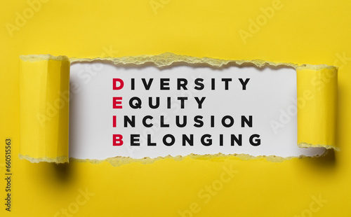 Diversity, Equity, Inclusion & Belonging Abbrevation under Ripped Paper