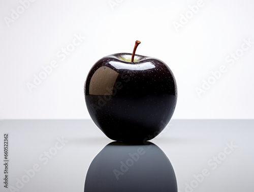 A glossy and shiny black apple