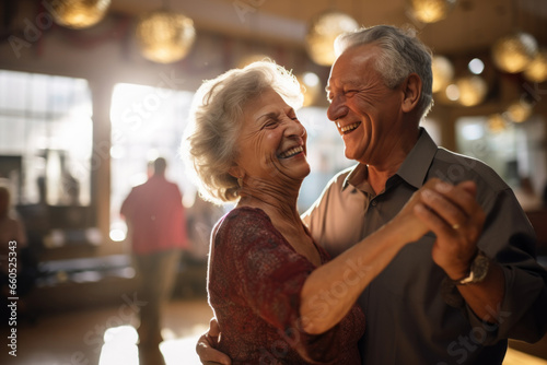 Joyful senior couple showing vitality while dancing in cafe, active lifestyle in retirement. Romantic retired people