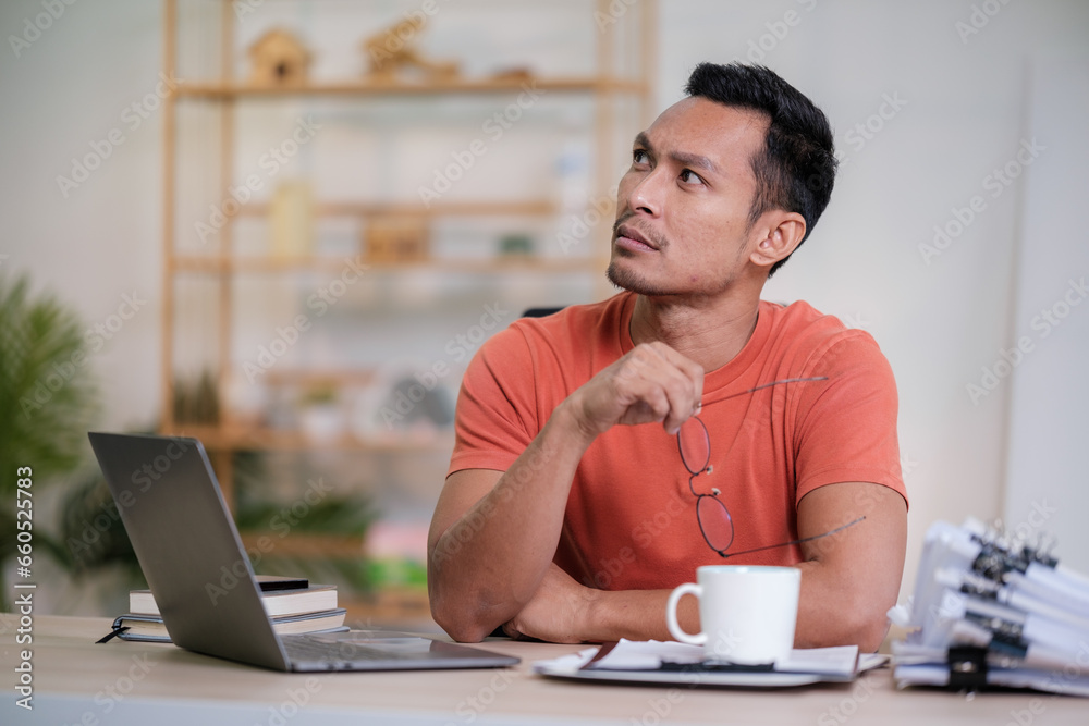 Happy man working on laptop. Technology people work study concept Happy man working on laptop. Technology people work study concept