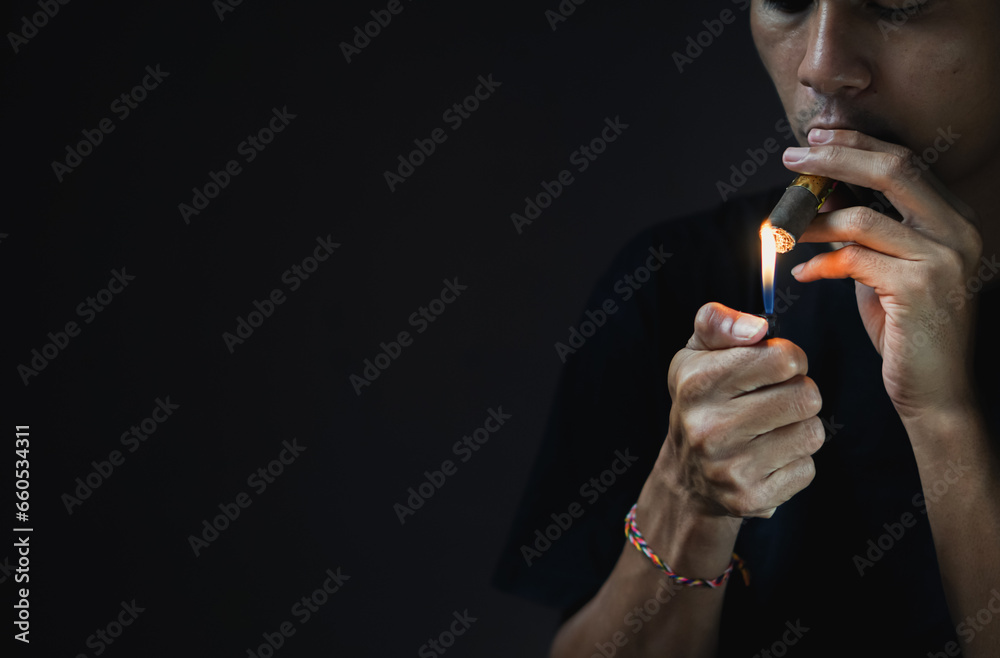 Fototapeta premium A man smoking a cigar.