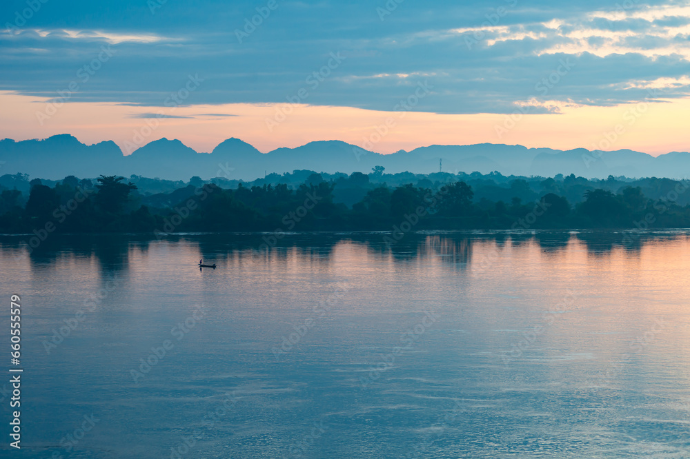 Beautiful panoramic views There are shiny fishing boats on the Mekong River that separates Thailand and Laos in the morning. The background is mountains. There is light sunlight. light Beautiful panoramic views There are shiny fishing boats on the Mekong River that separates Thailand and Laos in the morning. The background is mountains. There is light sunlight. light