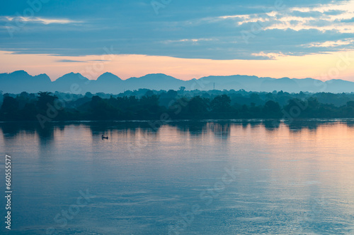 beautiful scenery The sun rises over the mountains in the early morning. In the foreground is the Mekong River, the border point for Thailand and Laos.