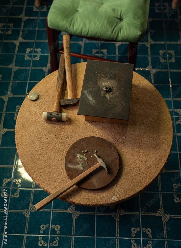 Chair and table of a handicraft workshop where jewelry and goldsmith pieces are made.