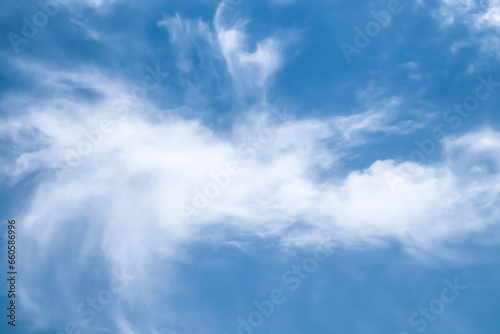 White clouds against the blue sky. Template for wallpaper, stretch ceilings