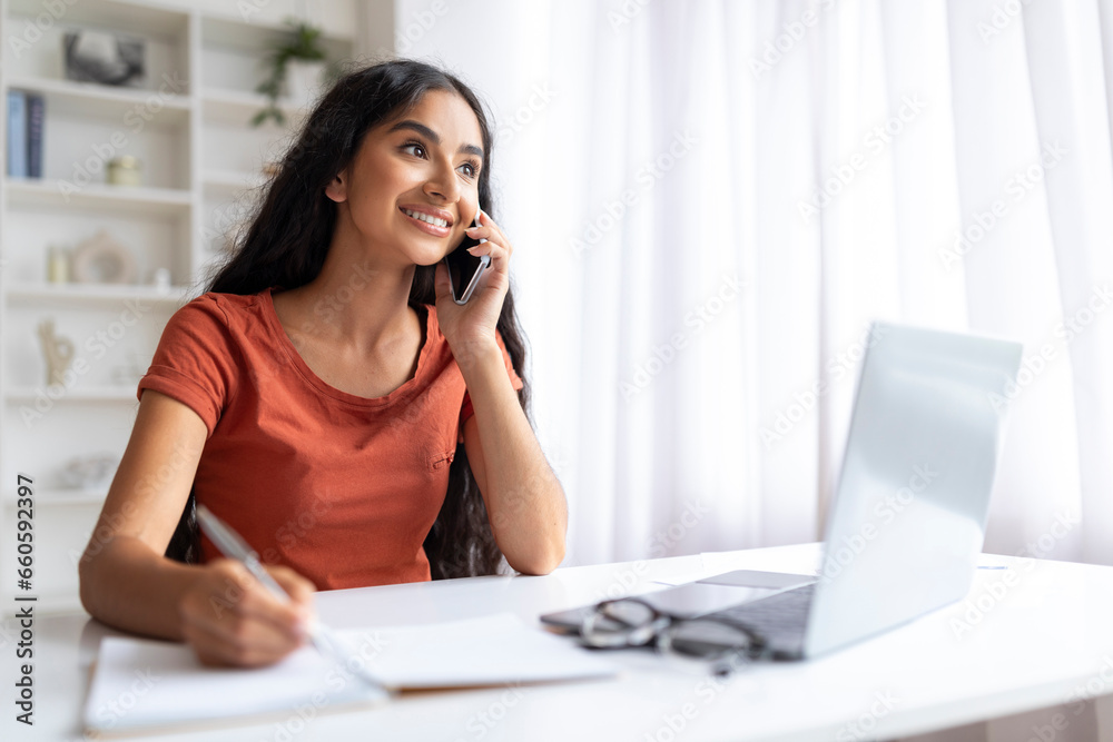 Woman Using Cellphone And Working On Laptop At Home Office Woman Using Cellphone And Working On Laptop At Home Office