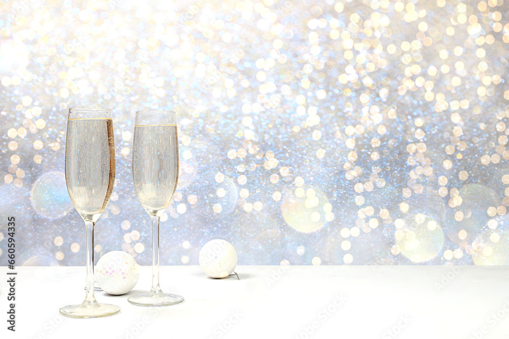 Two glasses of champagne on an elegant festive background with bokeh. Christmas and New Year layout for design and product display, Christmas Eve concept, Two glasses of champagne on an elegant festive background with bokeh. Christmas and New Year layout for design and product display, Christmas Eve concept,
