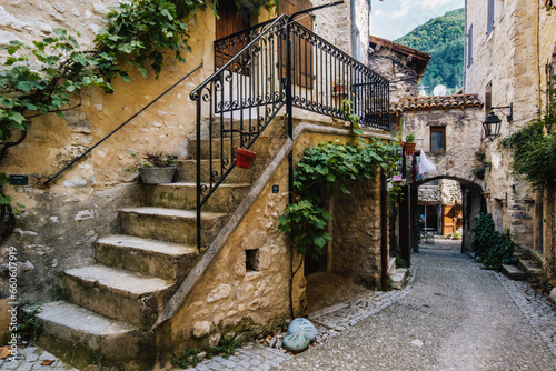 Fototapeta Naklejka Na Ścianę i Meble -  Street, staircase and old medieval houses in the small village of Chatillon en Diois in the south of France (Drome)