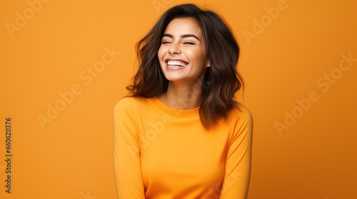 Happy beauty woman in orange color