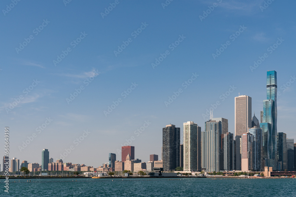 Fototapeta premium A view of Downtown skyscrapers of Chicago skyline panorama over Lake Michigan at daytime, Chicago, Illinois, USA