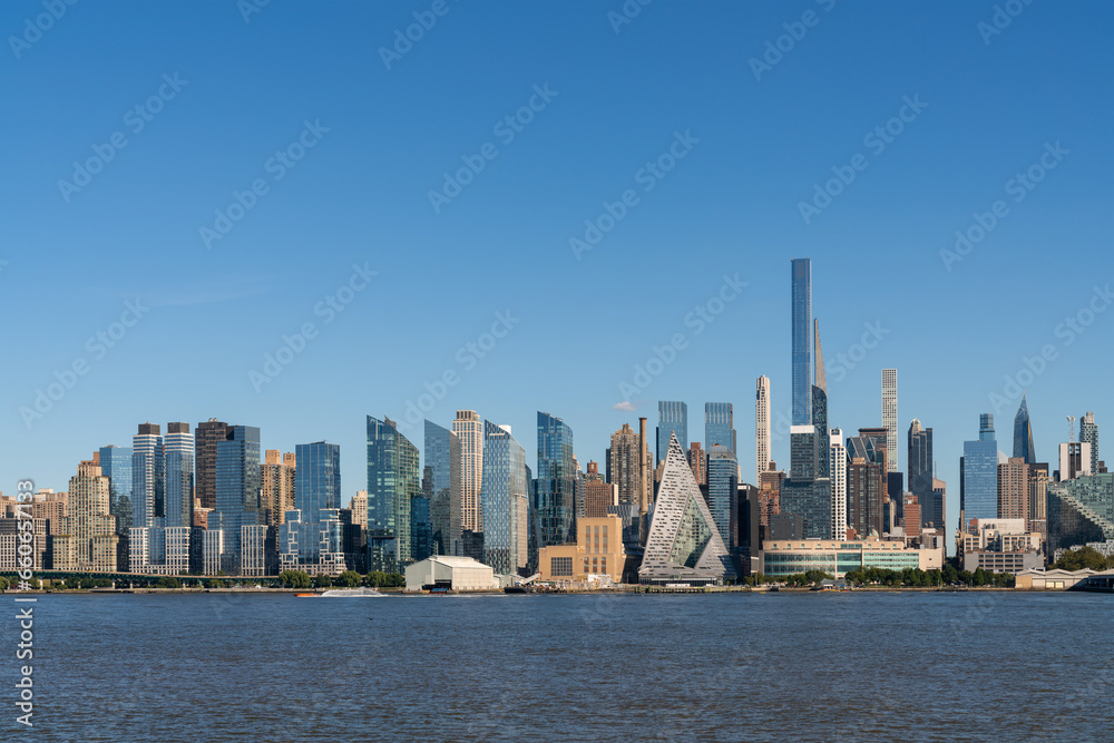 New York City skyline from New Jersey over the Hudson River with the skyscrapers at day time. Manhattan, Midtown, NYC, USA. A vibrant business neighborhood