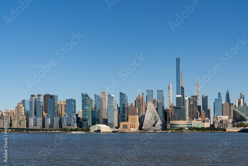 New York City skyline from New Jersey over the Hudson River with the skyscrapers at day time. Manhattan  Midtown  NYC  USA. A vibrant business neighborhood