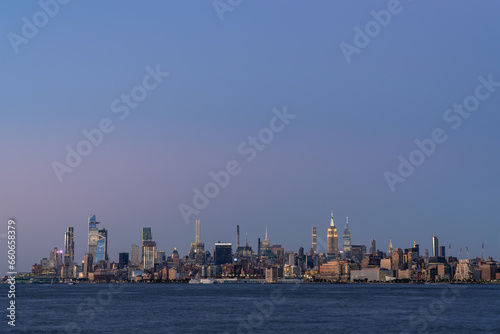 Aerial New York City skyline from New Jersey over the Hudson River with the skyscrapers at sunset. Manhattan  Midtown  NYC  USA. A vibrant business neighborhood