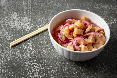 fish ceviche with onions and pepper. traditional peruvian food with tigra milk photo