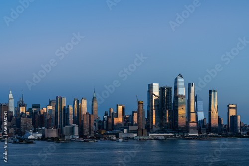Aerial New York City skyline from New Jersey over the Hudson River with the skyscrapers of the Hudson Yards district at sunset. Manhattan, Midtown, NYC, USA. A vibrant business neighborhood © VideoFlow