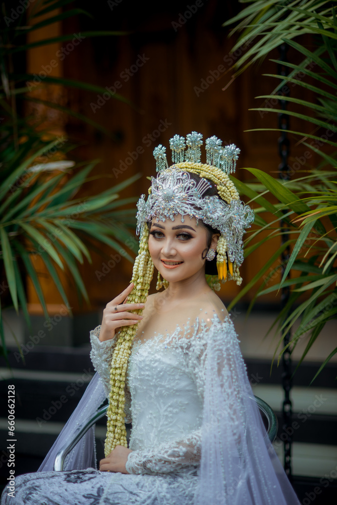 Amazing smiling bride. Traditional Javanese Bridal Portrait. Indonesian bride. Wedding day bride in wedding dress. Beautiful bride. Beautiful model. Javanese wedding dress. Akad Nikah Dress.