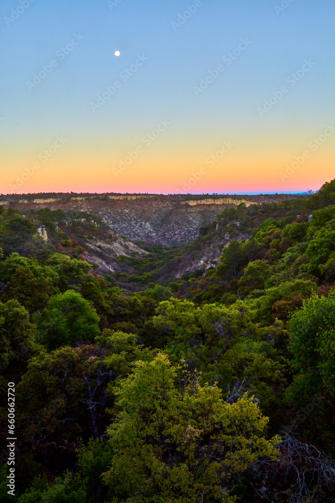 valley at sunset with beautiful colors in the sky, deciduos low forest in monte escobedo zacatecas 