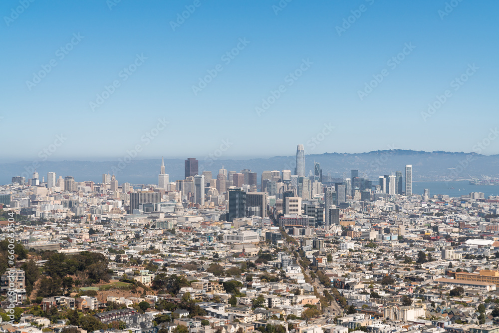 Panoramic view of San Francisco skyline at daytime from hill side area. Financial District and residential neighborhoods, California, United States.