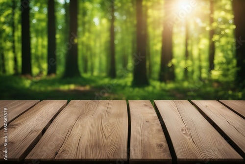Empty wooden table with vibrant green nature forest sunlight blurred background. High quality photo