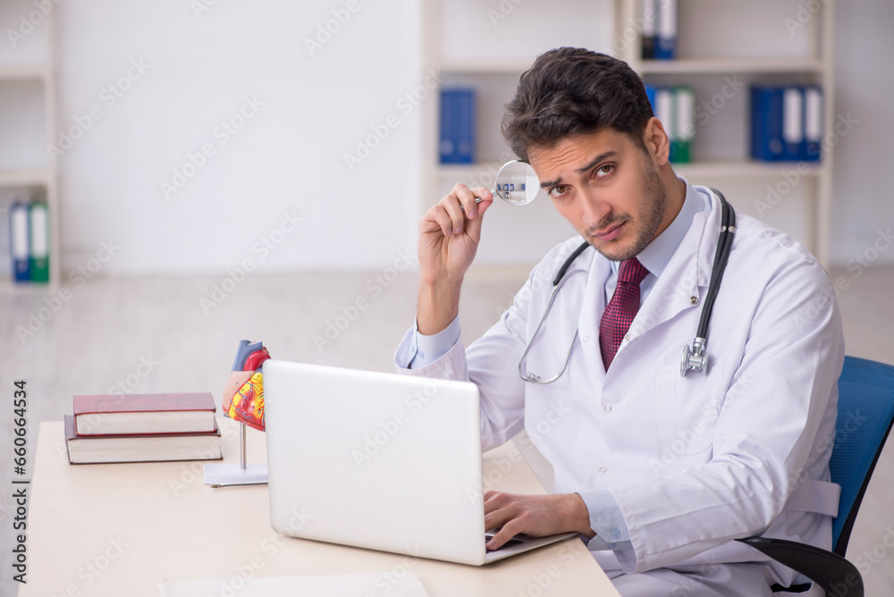 Young male doctor in telemedicine concept Young male doctor in telemedicine concept