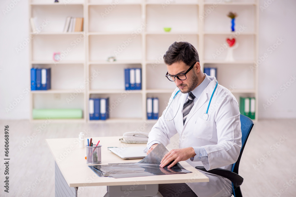 Young male doctor radiologist working in the clinic Young male doctor radiologist working in the clinic