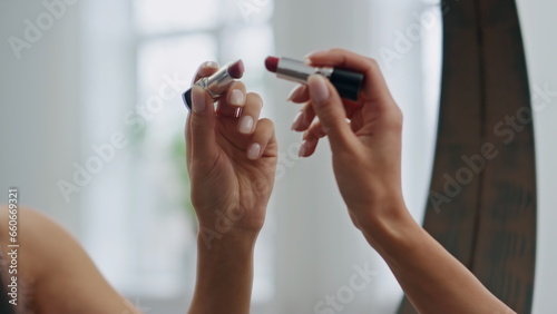 Woman hand drawing lipstick heart bathroom mirror closeup. Lady putting symbol