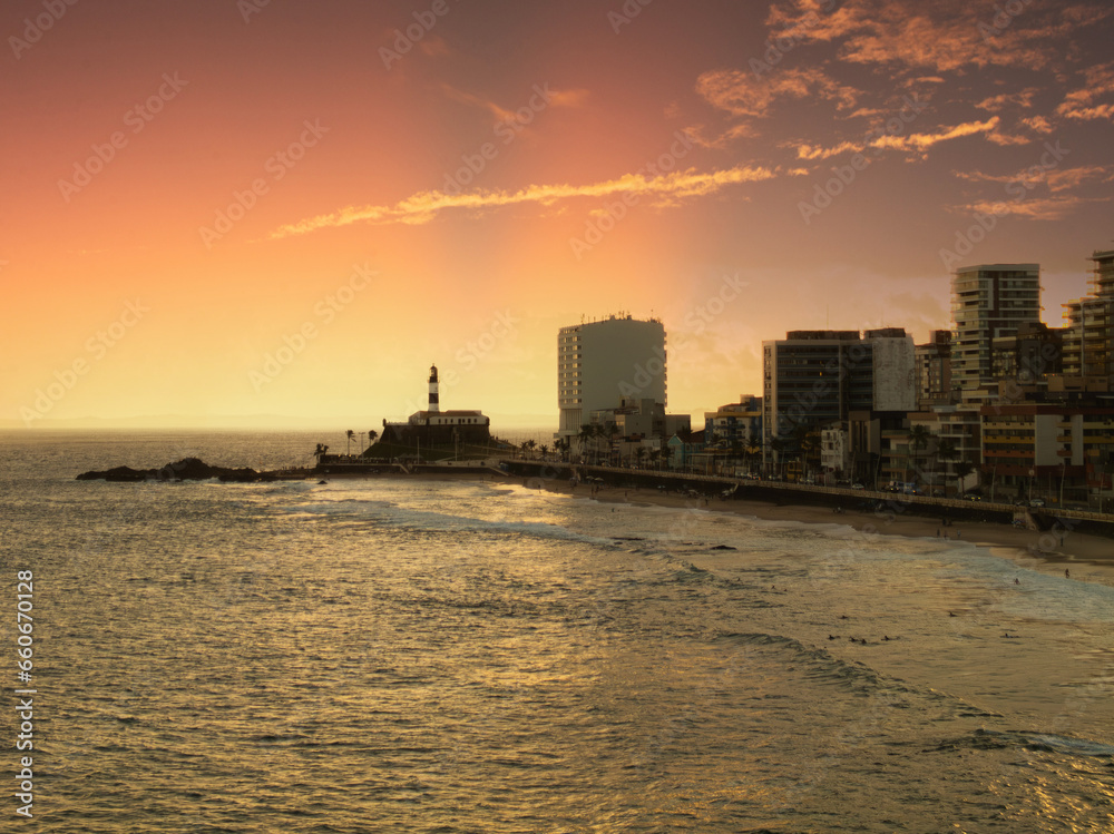 Sunset at Barra beach in Salvador Bahia with Barra Lighthouse in the background