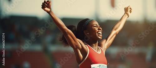close-up view of female runner athlete happy when becoming winner photo
