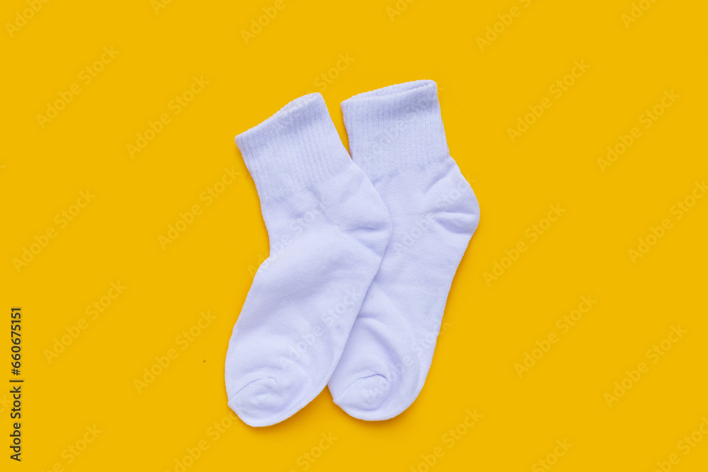 White socks on yellow background. White socks on yellow background.