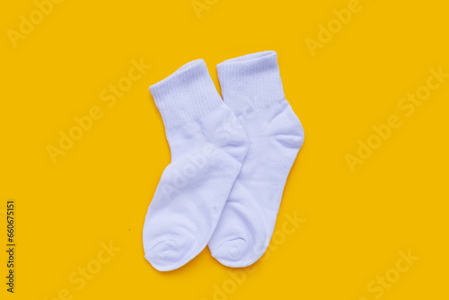 White socks on yellow background.
