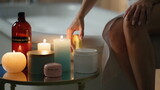 Girl moisturizing hands evening room closeup. Relaxed woman applying skin cream