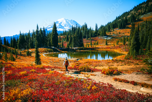 Girl hiking Through In The Chinook Pass Area of Mount Rainier National Park at Fall, Naches Peak Loop Trail photo
