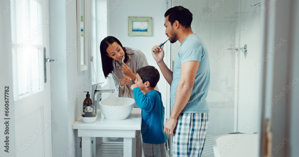Parents, child and brushing teeth in family home bathroom while learning or teaching dental hygiene. A woman, man and kid with toothbrush and toothpaste for health, cleaning mouth and wellness Parents, child and brushing teeth in family home bathroom while learning or teaching dental hygiene. A woman, man and kid with toothbrush and toothpaste for health, cleaning mouth and wellness
