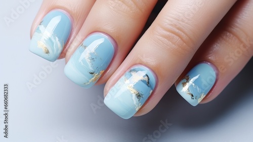 A woman's hand with a sky-blue and gold manicure. A nail polish design. Generative AI.	
