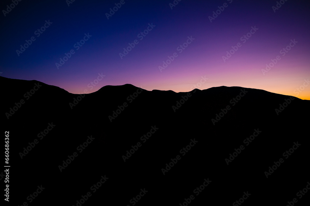 Beautiful Sunrise landscape over mountain ridge