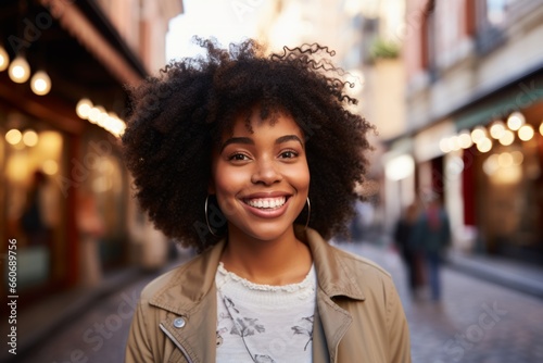 Portrait confident joyful stylish young wide smiling healthy white teeth African American businesswoman lady female student walking downtown outside. Relaxation enjoying weekend positive expression