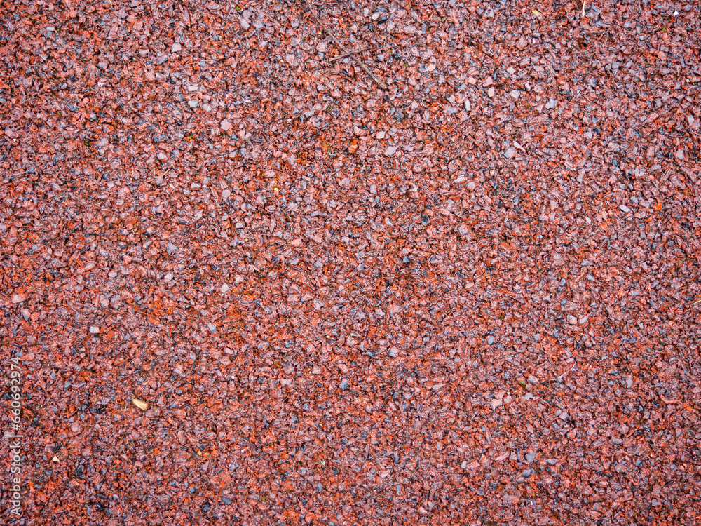 Brown texture. Polymer background. The surface of the playground. Ground for playing. Safe surface. Brown texture. Polymer background. The surface of the playground. Ground for playing. Safe surface.