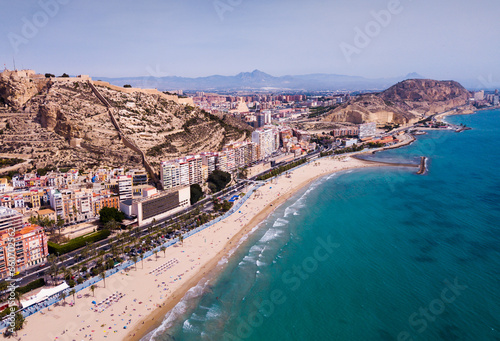 View of Alicante embankment and Mount Benacantil with medieval fortified castle on Mediterranean coast, Spain © JackF