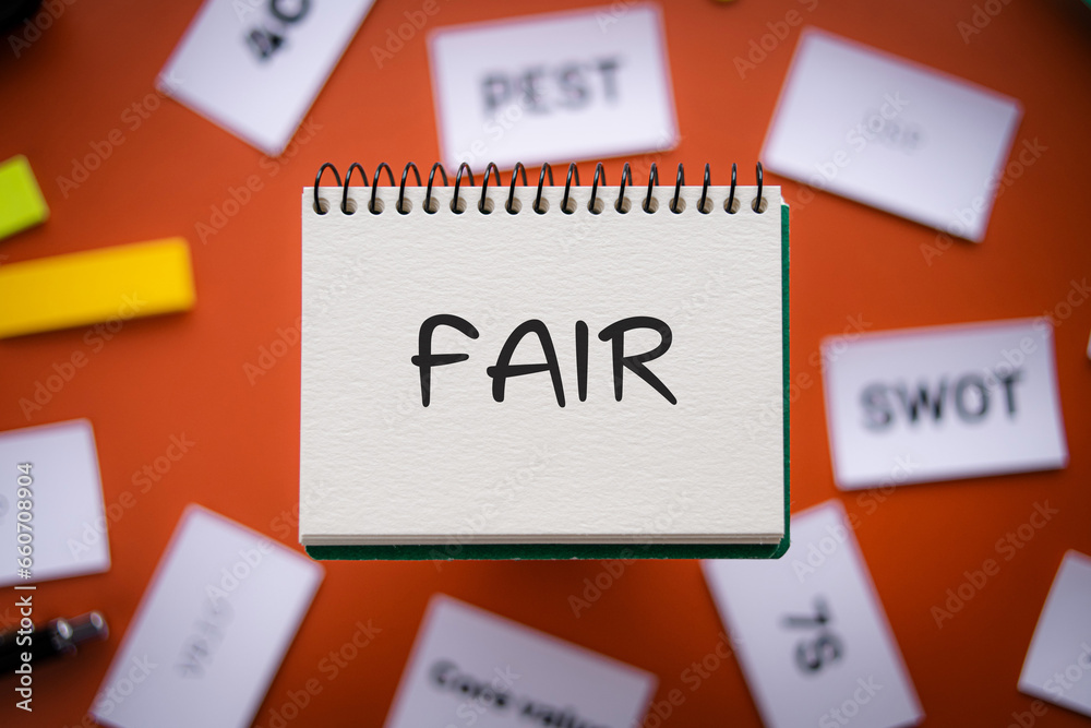 There is notebook with the word FAIR. It is as an eye-catching image. There is notebook with the word FAIR. It is as an eye-catching image.