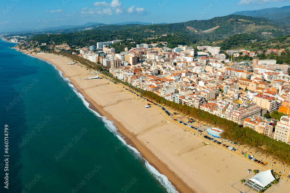 Townscape of Calella, Maresme region, Spain. View of sea coast and beach.