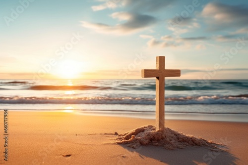 Concept photo of a calm and peaceful beach, with a simple wooden crucifix p in the sand, surrounded by seashells and with the sun rising behind it, reminding us of the timeless message of