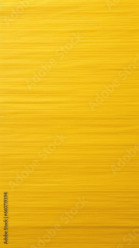 Texture of a bright yellow lined notebook paper, lined with thick and bold black lines, creating a bold and eyecatching contrast.