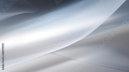 Texture of transparent tracing paper with a glossy sheen, reflecting light to create a luminous effect on its surface.