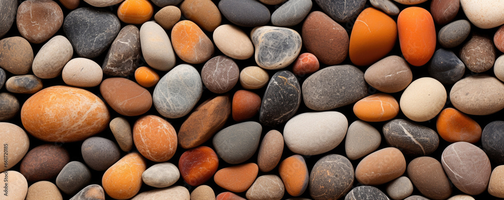 Texture of a pebble stone with small, smooth pebbles in shades of rust and burnt orange, giving off a warm and cozy feel. Texture of a pebble stone with small, smooth pebbles in shades of rust and burnt orange, giving off a warm and cozy feel.