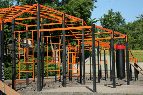 Empty outdoor gym with exercise equipment in park