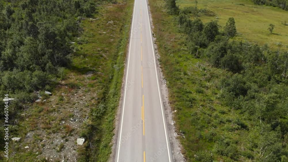 Bus Driving On Highway 9 In The Norwegian Countryside In Agder, Norway. aerial tilt-down Bus Driving On Highway 9 In The Norwegian Countryside In Agder, Norway. aerial tilt-down