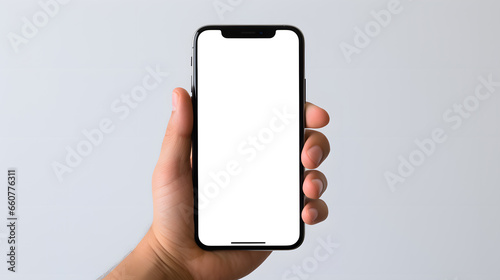 male hand holding a smartphone for mockup with isolated screen on gray background