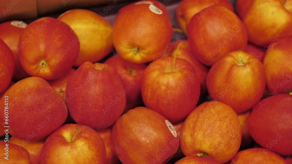 Organic apples with produce stickers in a grocery store Organic apples with produce stickers in a grocery store